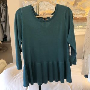 Perfect top for work, cute ribbon detail in back.